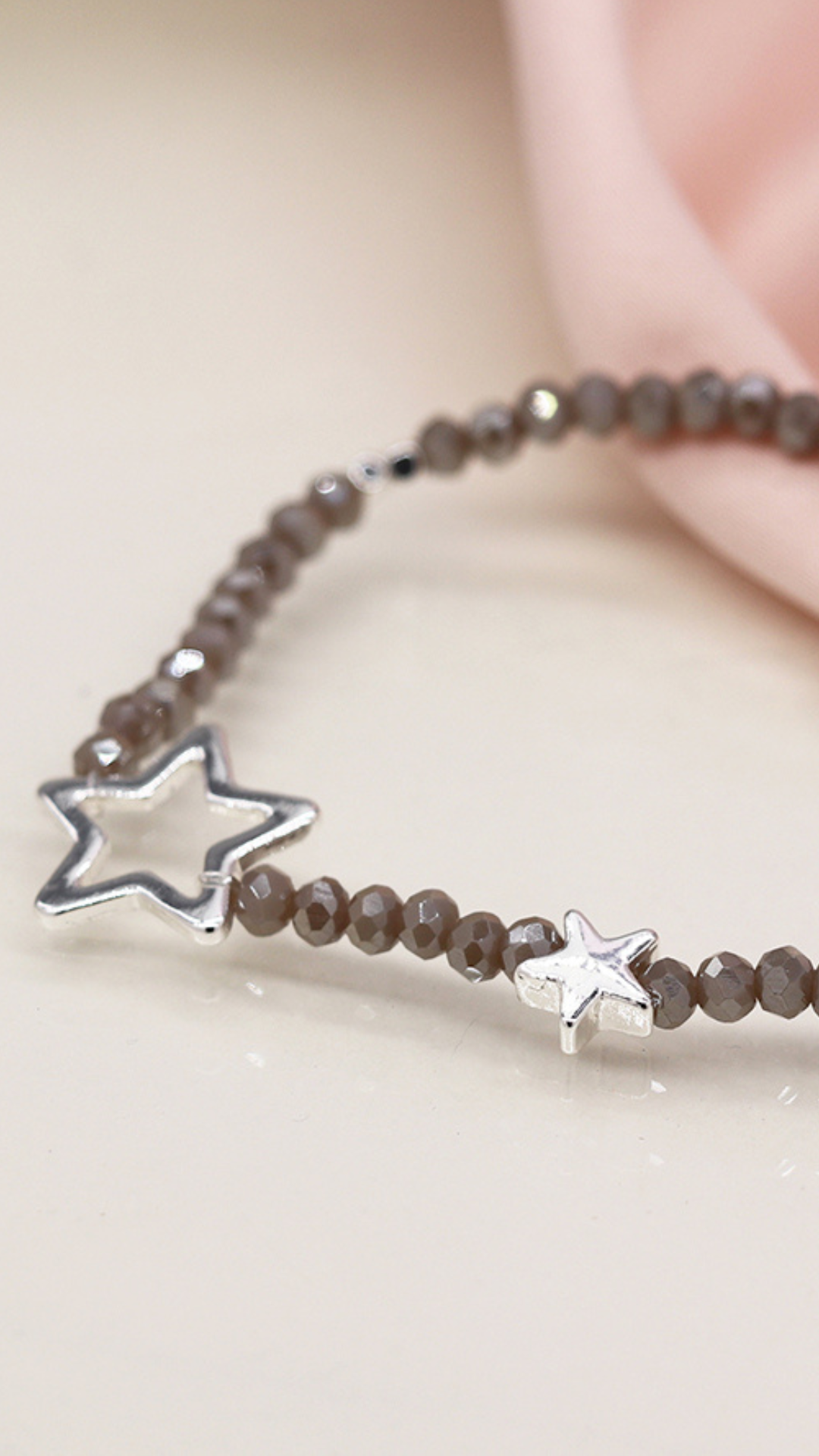 GREY BEAD BRACELET WITH SILVER PLATED STARS