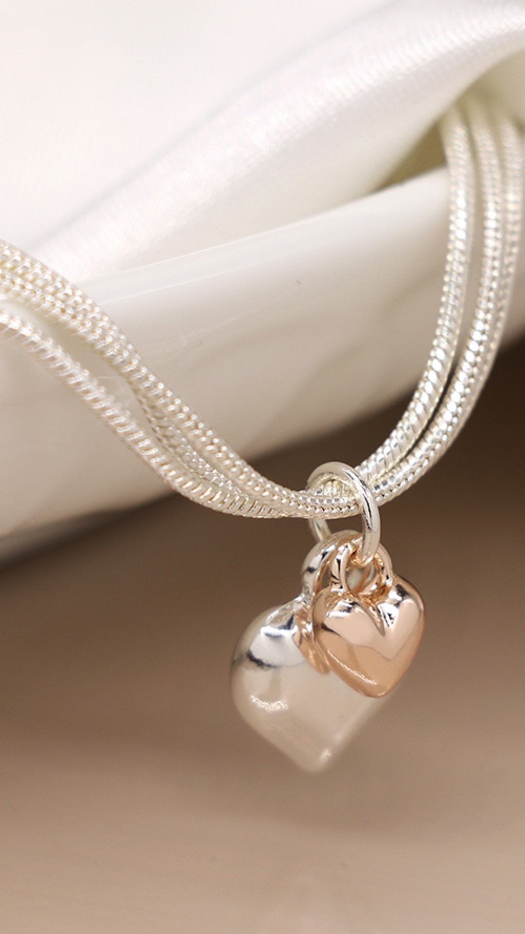 TRIPLE CHAIN BRACELET WITH HEARTS